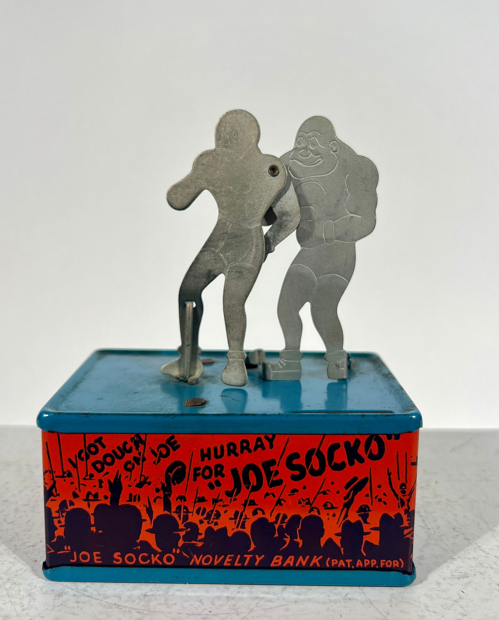 Joe Socho Tin Mechanical Bank: By Straits Corp - Detroit, MI. 1930's - 3 1/2"L x 4 1/2"T x 2 1/4"D