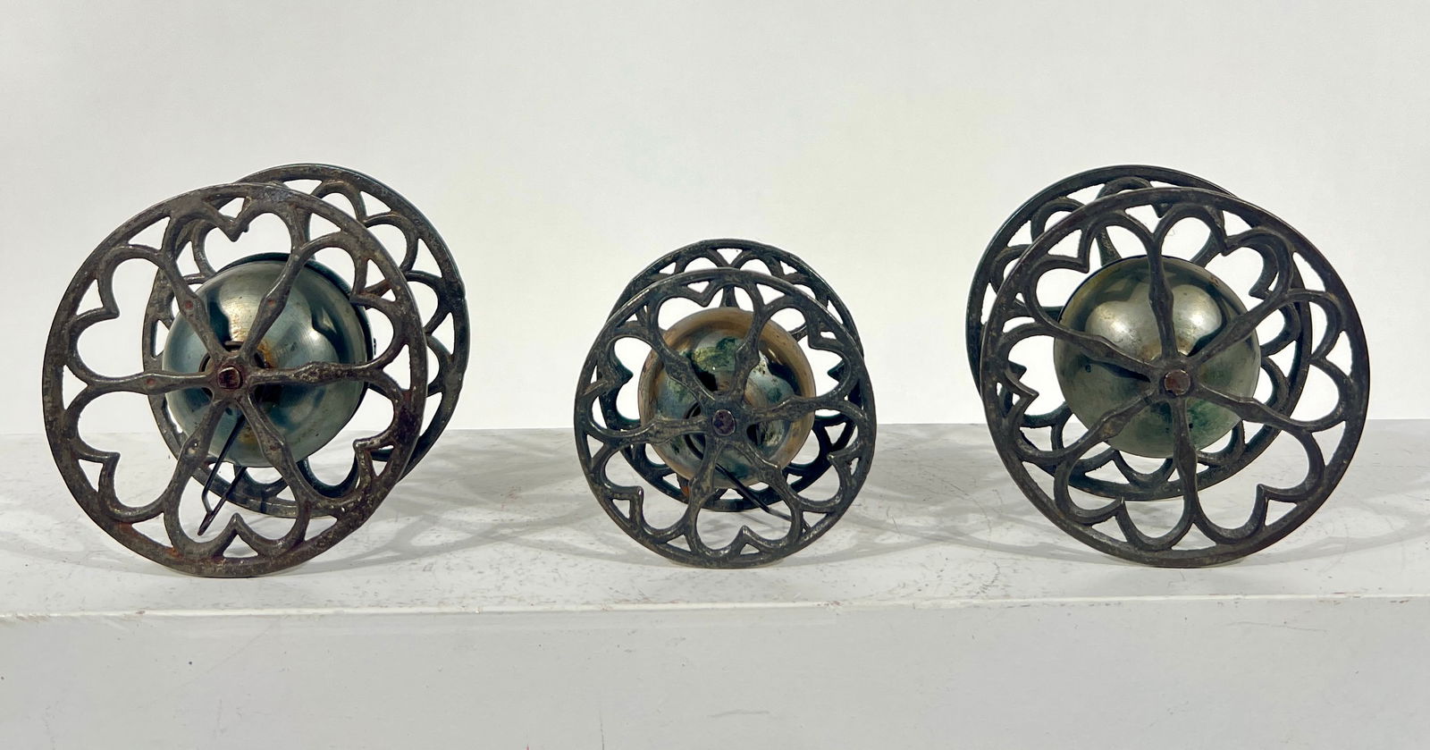 Three Rolling Bell Toys: Gong Bell Mfg. Co. - Connecticut 1890 - Largest are 3 1/2"T