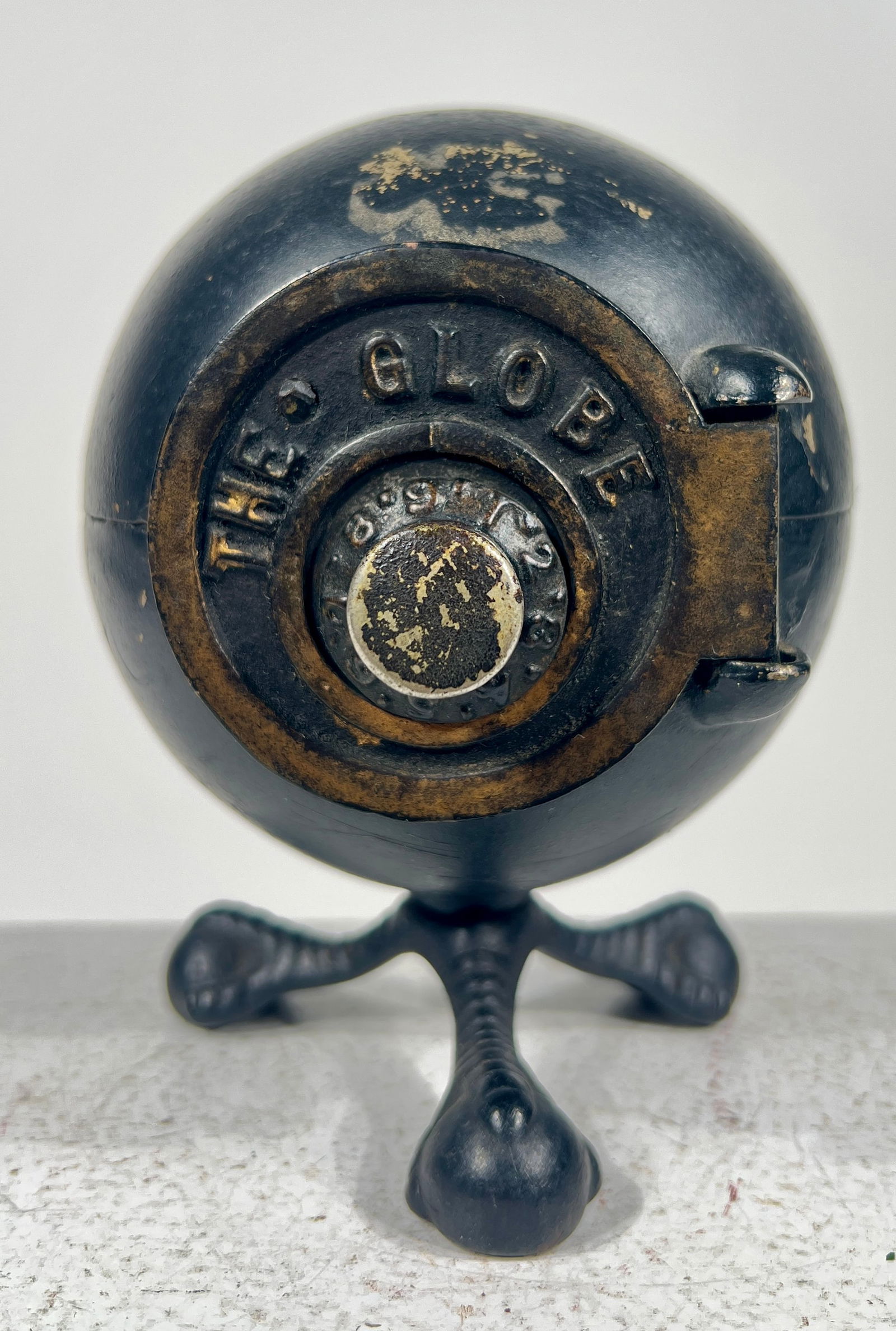The Globe Cast Iron Safe Bank with Ball and Claw Feet: American 1890's - 5 1/4"T x 4 1/4"W x 4 1/2"D