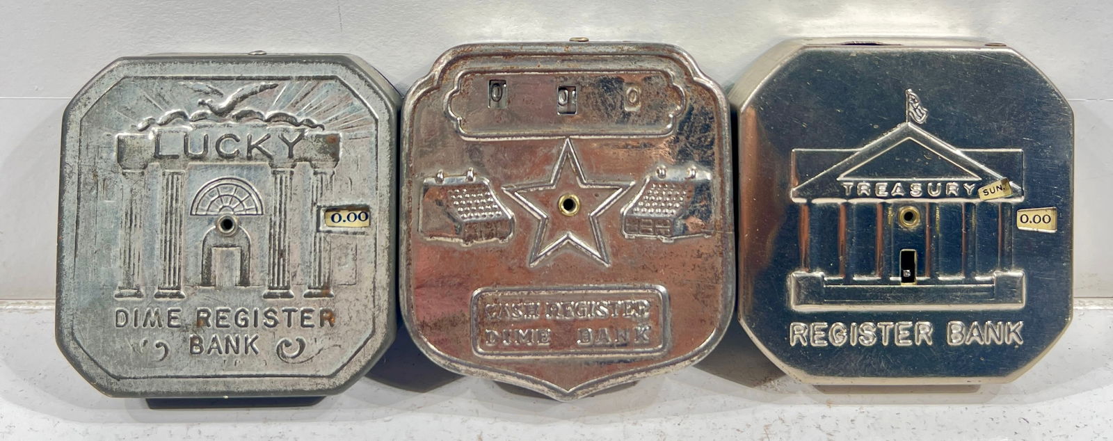 Three Tin Dime Register Banks - Lucky, Cash Register Dime, and U.S. Treasury (1 of 2)