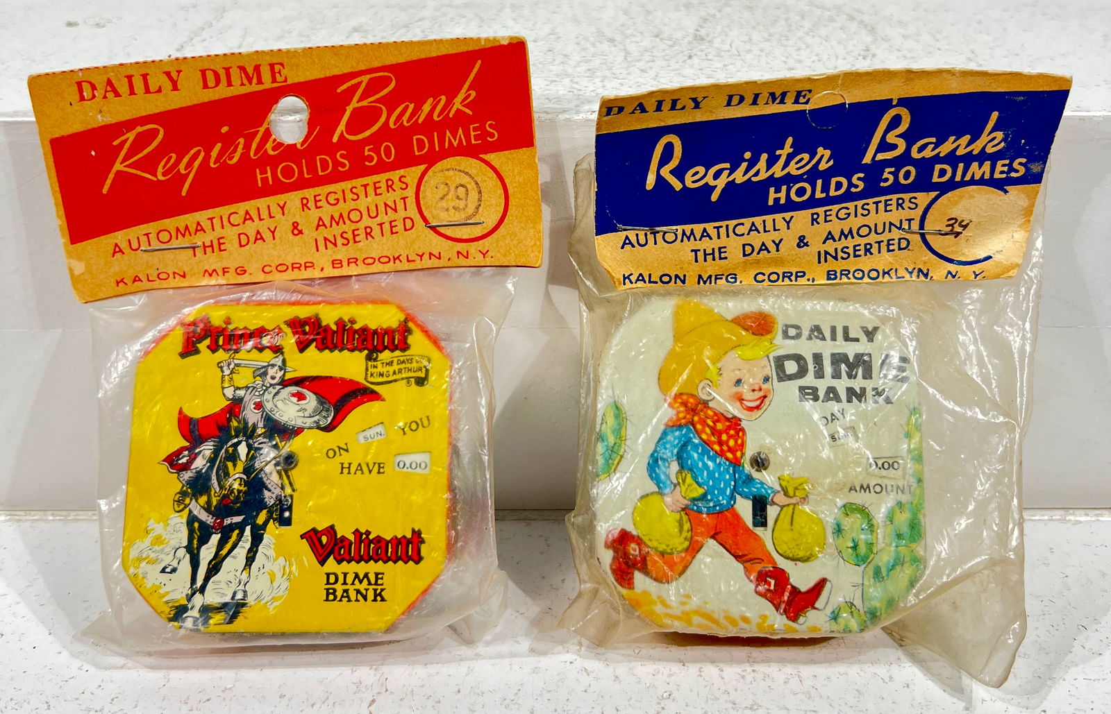 Two Tin Dime Registers in Original Packaging - Prince Valiant - Daily Dime Cowboy (1 of 2)