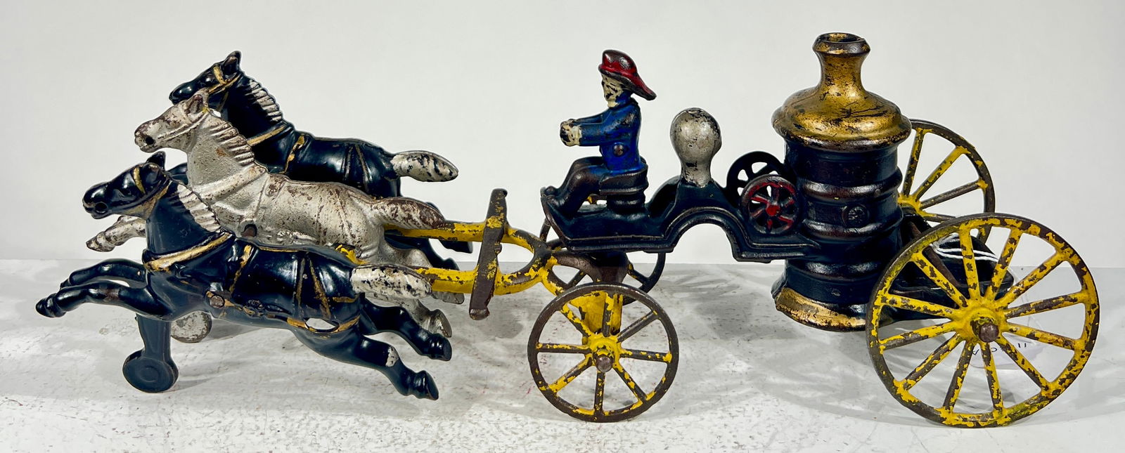 Three Horse Cast Iron Fire Pumper: Kenton Hardware - Kenton, OH. 1915 - 13 1/4"L x 4 3/4"T x 3"D The Olshefski Collection