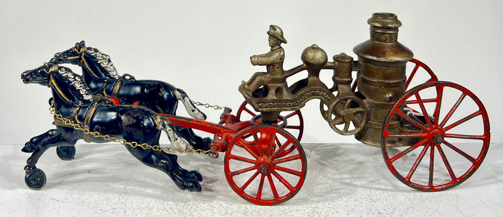 Two Horse Cast iron Fire Pumper: Kenton Hardware - Kenton, OH. 1915 - 15"L x 5 3/4"T x 3 1/2"D The Olshefski Collection