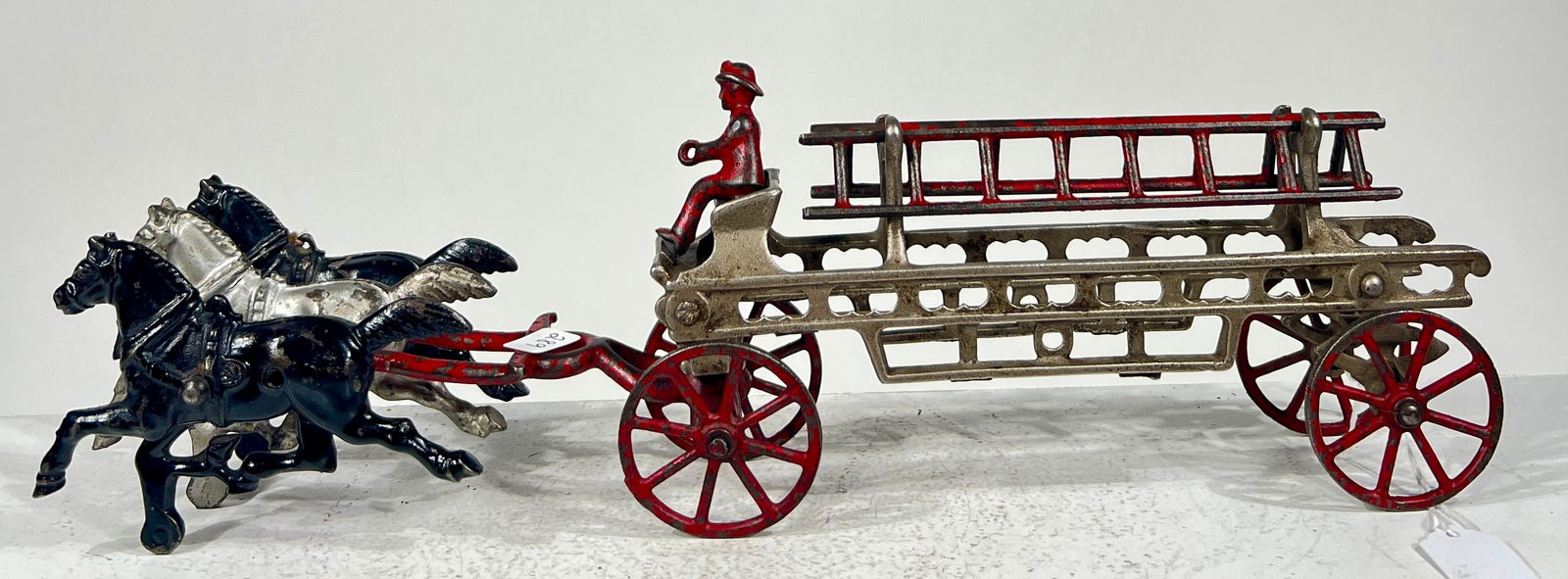 Three Horse Cast Iron Hook and Ladder: Kenton Hardware - Kenton, OH. 1915 - 14 1/2"L x 4"T x 3"D The Olshefski Collection