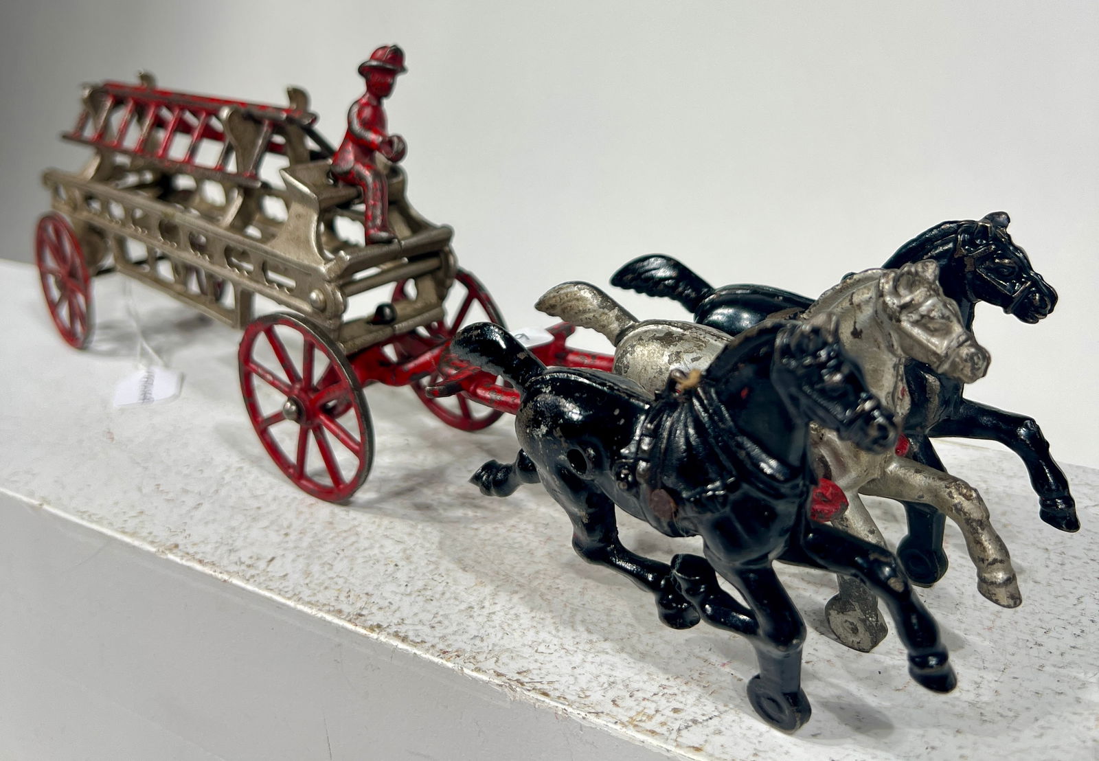 Three Horse Cast Iron Hose Reel: Dent Hardware - Fullerton, PA. 1915 - 14 3/4"L x 5"T x 6"DThe Olshefski Collection