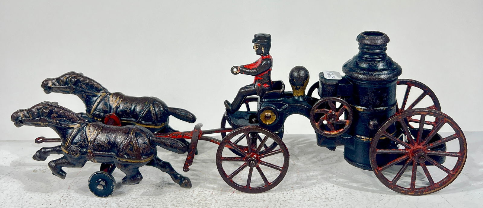 Two Horse Cast Iron Fire Pumper: Wilkins Hardware Keene, NH 1895- 12 1/2"L x 4 3/4"T x 3"D The Olshefski Collection