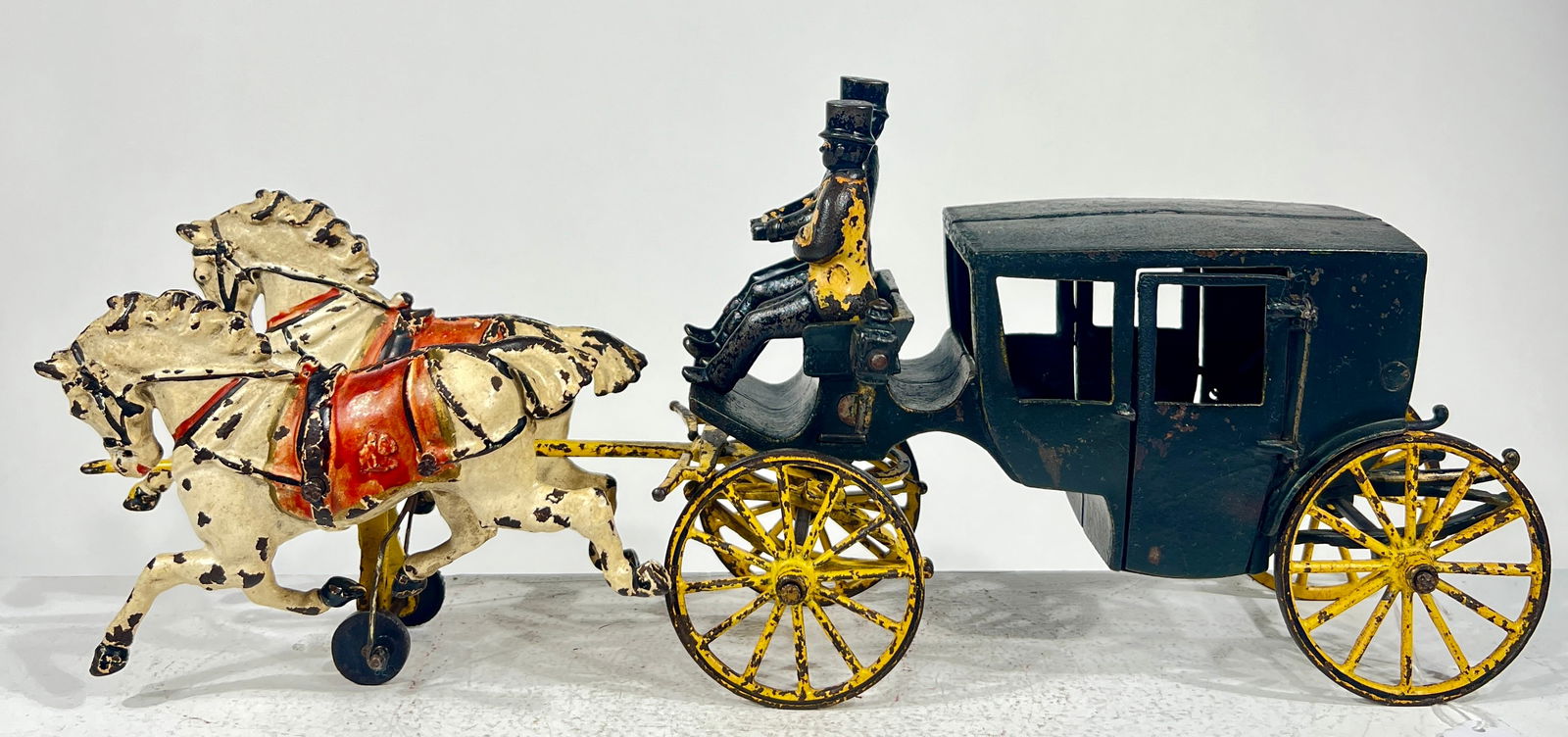 Two Horse Cast Iron Landon with Functioning Doors: Wilkins Hardware- Keene, NH- 1895 15"L x 6 1/2"T x 4 1/4"DThe Olshefski Collection