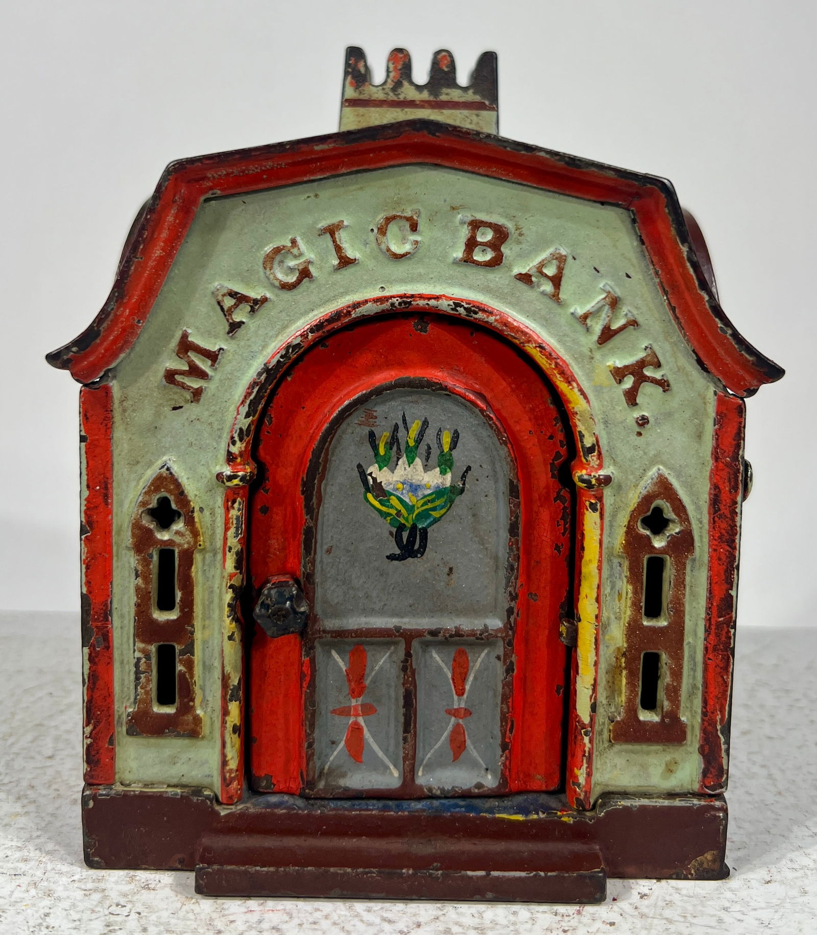Magic Bank- Green: J. + E Stevens Company Cromwell, CT- 1870's5 1/2"T x 4 1/2"W x 5 1/4"DThe Olshefski Collection