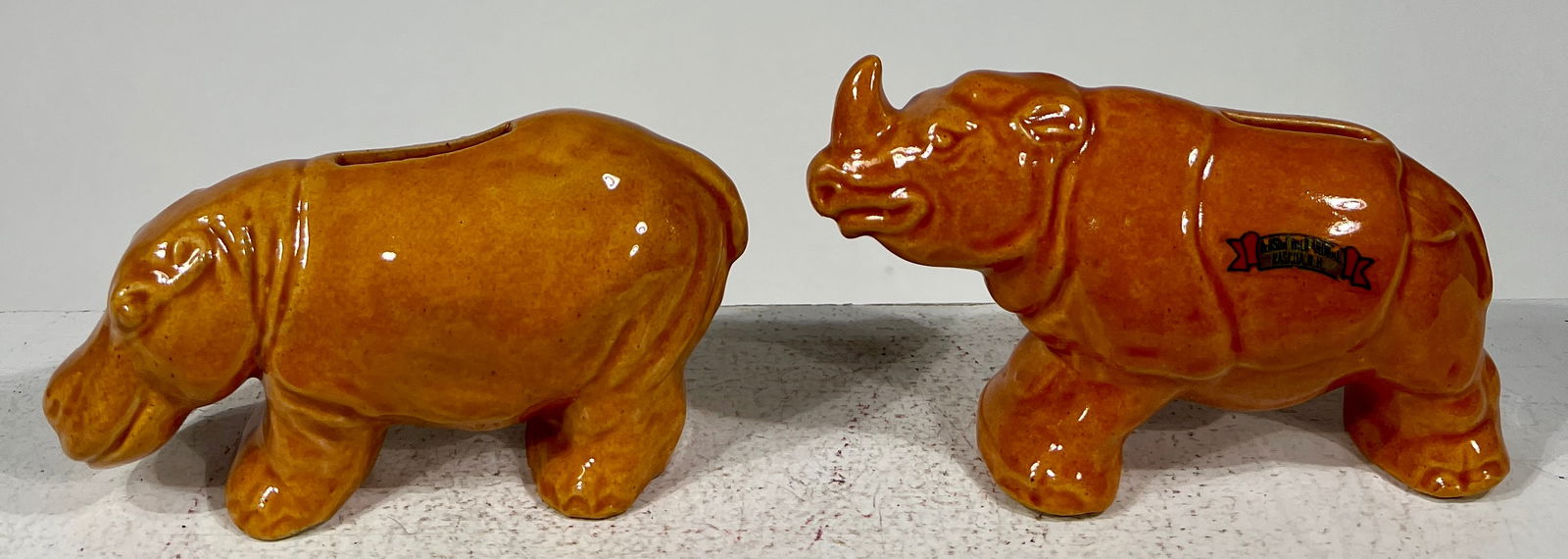 Rhinoceros and Hippo Pottery Banks: American- 1930'sLarge One- 5 3/4"L x 3 1/2"T x 2"DThe Pierce Collection