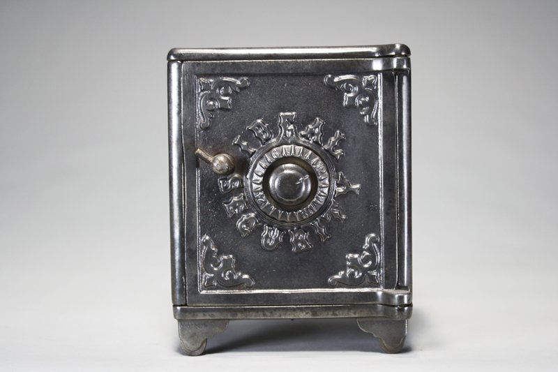 Ideal Security Bank Still Bank: American – Circa 1895 This charming bank is 5 ¼” tall. Material: Cast Iron