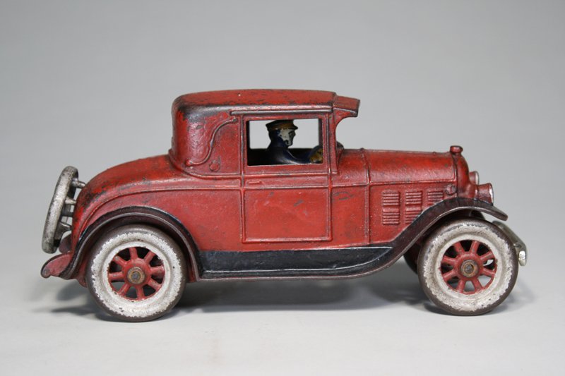 1926 Plymouth Coupe Kenton Cast Iron: Kenton Hardware Kenton, Ohio – Circa 1920 This is a very scarce cast iron automobile. A great addition to your collection. It is 10 ¼” long, Material: Cast Iron