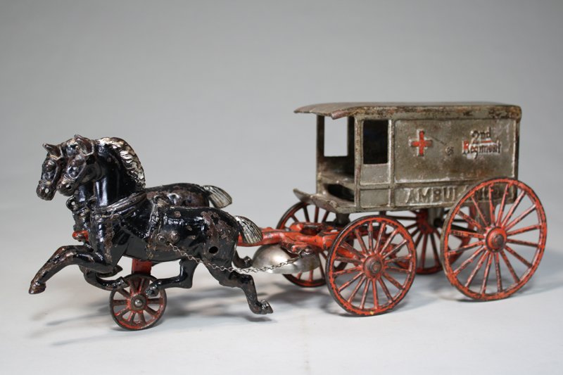 2nd Regiment Ambulance Kenton Cast Iron: Kenton Hardware Kenton, Ohio – Circa 1895 It depicts a Civil War Era ambulance from the 2nd regiment of the Union Army. The toy is 15” long. Material: Cast Iron