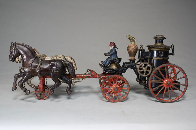 Clockwork Fire Pumper Ives Cast Iron: Ives, Blakeslee Company Bridgeport, Connecticut – Circa 1890 This is the scarce upgraded version with a clock mechanism built into the boiler. When wound, the boiler piston and wheels turn. The toy