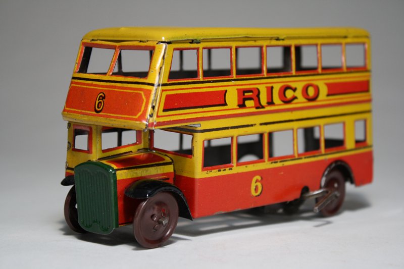 Rico Double Decker Bus: Rico Toy Company Spain – Circa 1935 This is a wonderful pre World War II windup bus. It is 6 ¼” long. It works well. Material: Tin