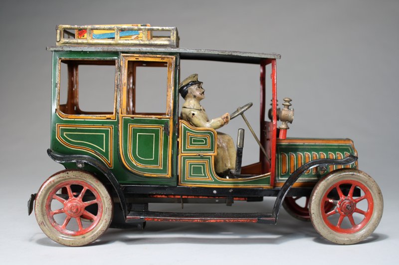 Open Limousine: Hans Eberl Company Germany – Circa 1912 This is a scarce early open limousine in all original condition. The toy is 11” long and works well. Material: Tin