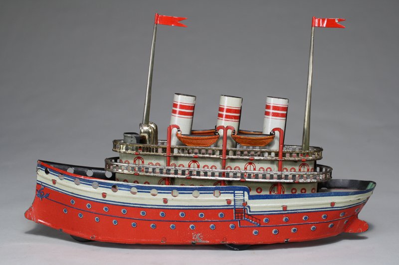 Early Ocean Liner: Made by Riehl Germany – Circa 1920 This is a scarce boat with fantastic lithography. It is 11¼” long and works well. Material: Tin