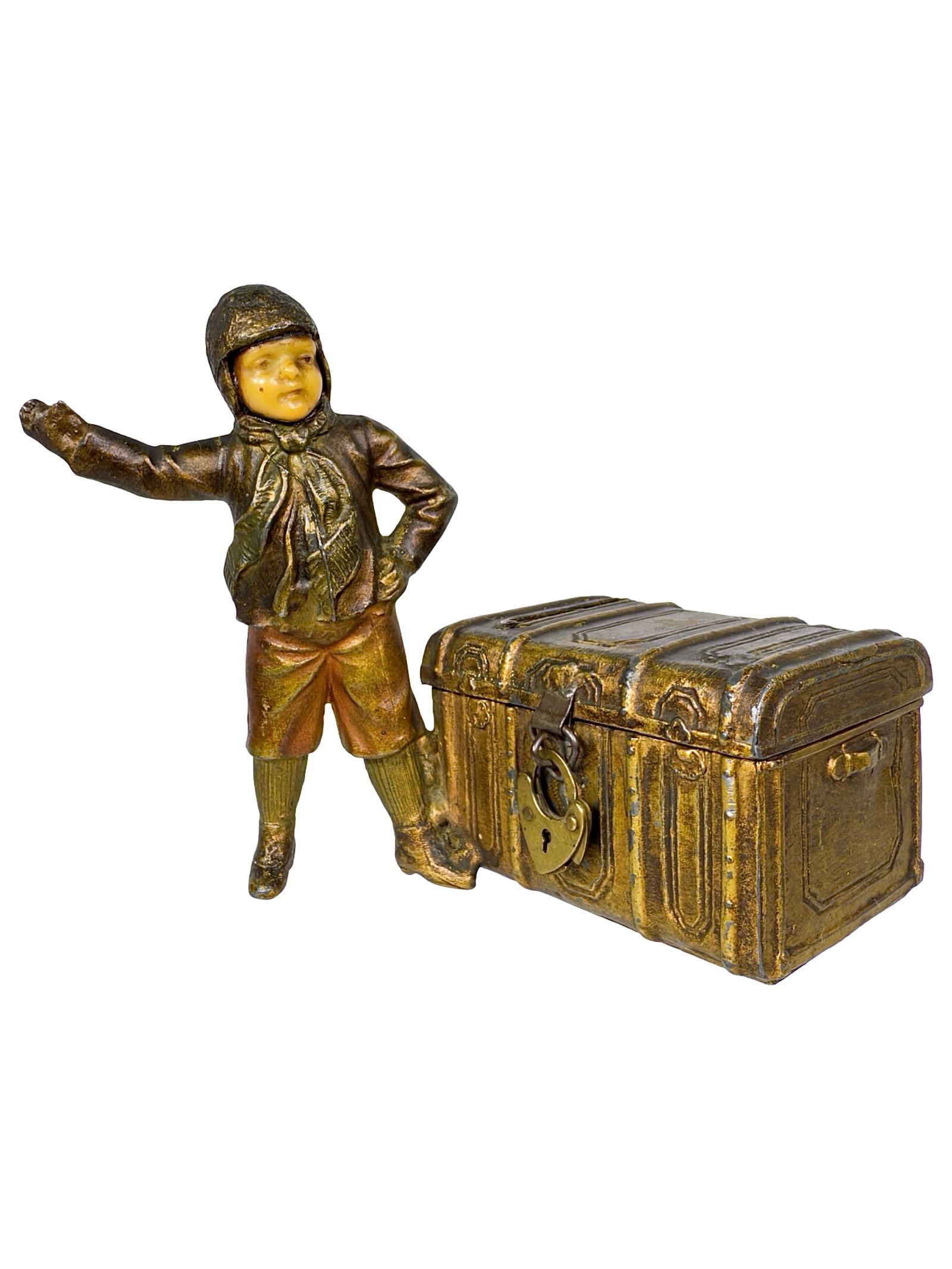 Boy Standing Beside Steamer Trunk Spelter Bank: Rare Spelter Piece with Carved Face. Germany - Circa Mid 1910's. 3 3/4" Tall x 4 3/8" Wide x 3" Deep. Mate to Girl Beside Steamer Trunk. Bob and Shirley Peirce Collection.