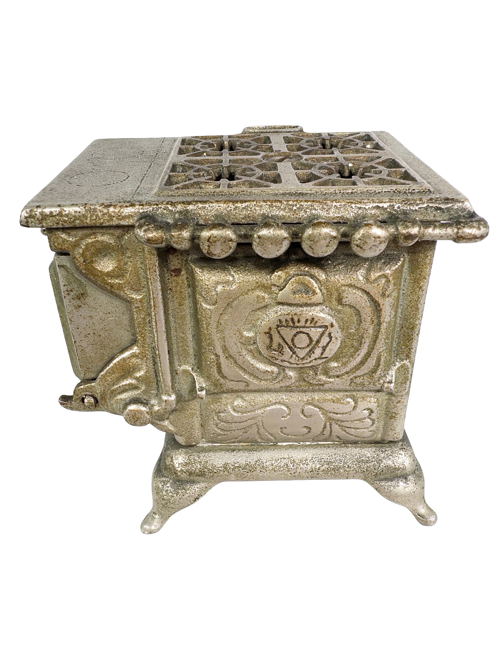 Ornate Kitchen Stove Bank: By the Ideal Toy Company. USA - 1900's - 3" T x 3 1/2" W. From the Mike Henry Collection.