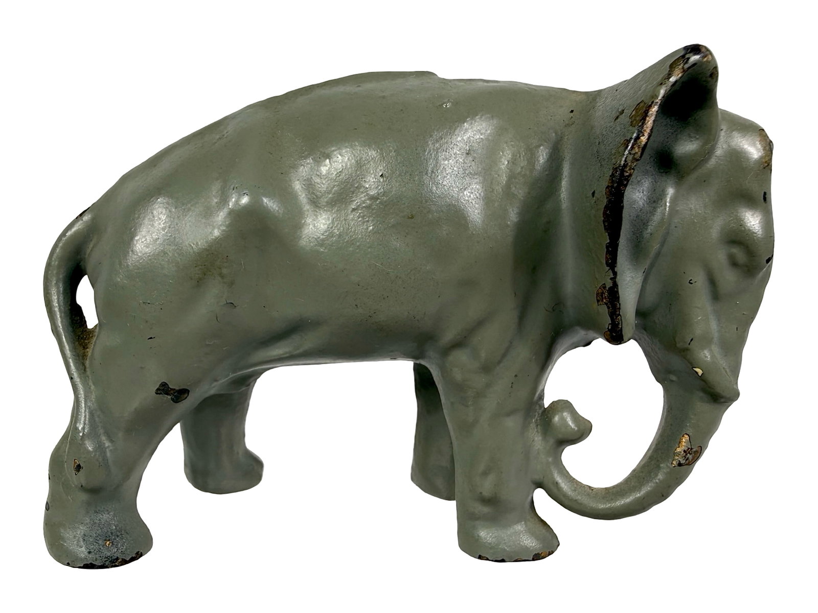 Gray Elephant with Tucked Trunk - Cast Iron Bank: Made by the Arcade Mfg. Company. Illinois - 1920's - 2 1/2" T x 4 1/2" W. Bob & Shirley Peirce Collection.