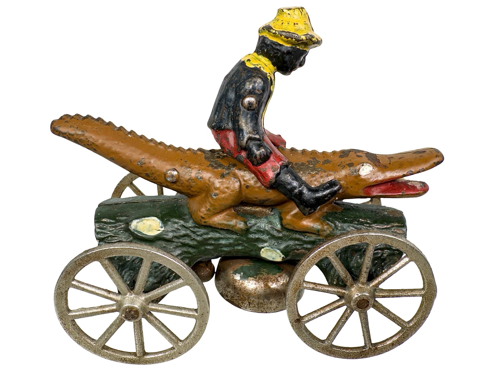 Boy Riding Alligator Bell Toy: Made by the N. N. Hill Brass Company. East Hampton - 1899 - 4 3/4" T x 6" L. Depicting African-American children or infants as "alligator bait" was a popular racist trope in North American white cultu
