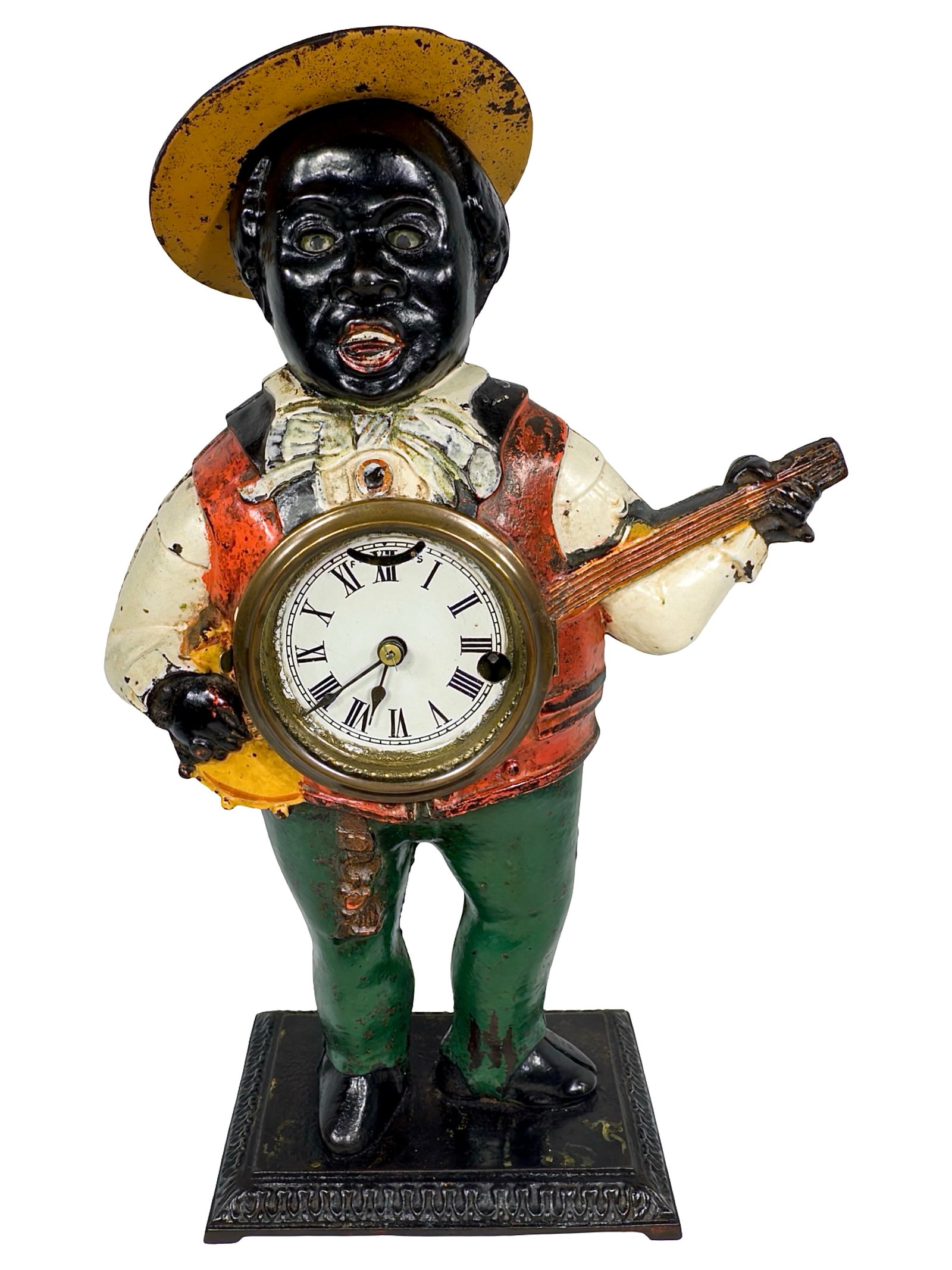 Banjo Player Blinking Eye Clock: By Bradley & Hubbard Company. Connecticut - Circa 1880's. 15 1/2" Tall x 10 1/2" Wide x 4 1/2" Deep.