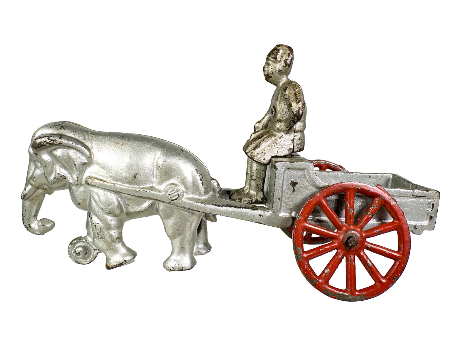 Elephant Drawn Flatbed Cart - Cast Iron Toy: By the Kenton Hardware Company. Kenton, Ohio - Ca. 1911 - 7 3/4" L. The John & Kira Olshefski Collection.