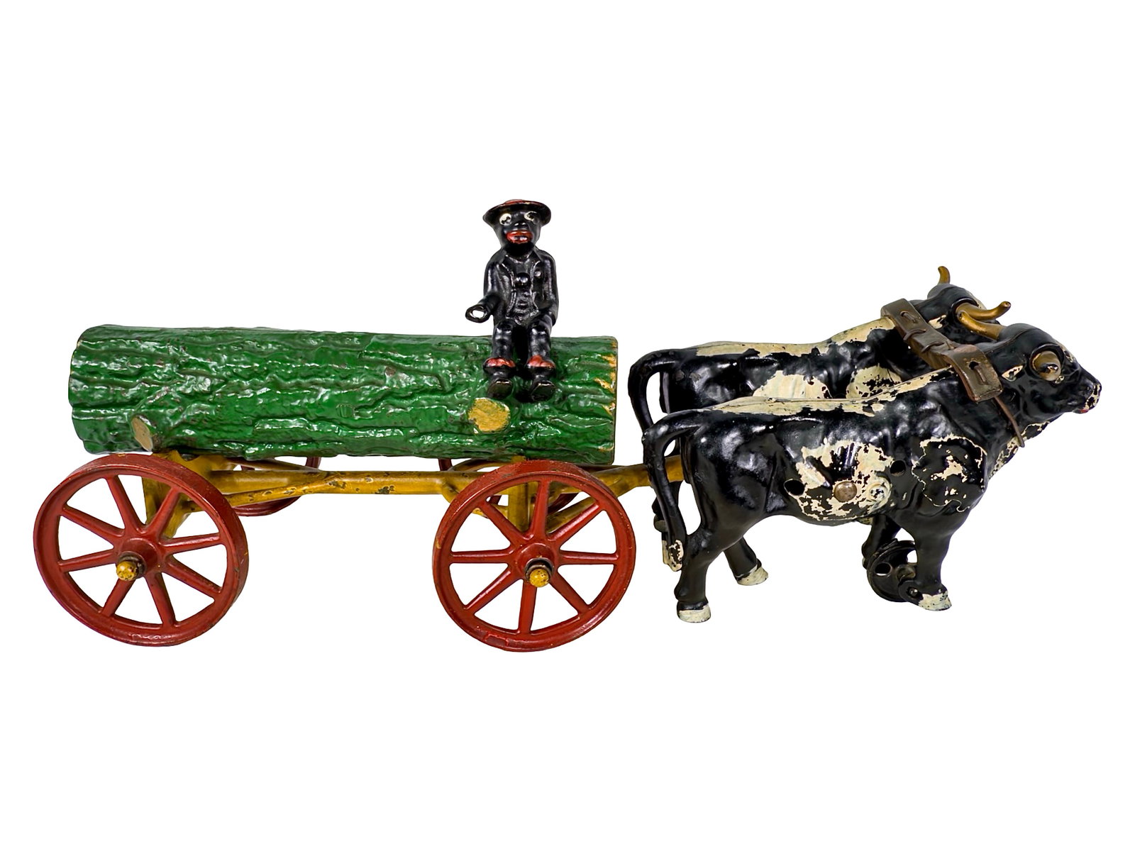 Oxen Drawn Log Wagon - Cast Iron Toy: By the Kenton Hardware Company. Kenton, Ohio - Circa 1910's. 16 1/4" Long x 5 1/2" Tall. The John & Kira Olshefski Collection. This is such an attractive toy that it's difficult to rave more highly ab