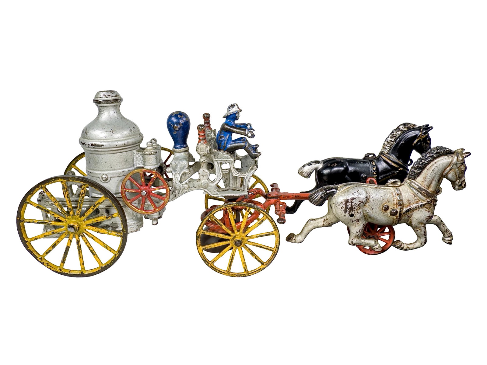 Two Horse Silver Fire Pumper - Cast Iron Toy: The Kenton Hardware Company. Kenton, Ohio - Early 1900's. 15 1/2" Long x 6 3/4" Tall. The John & Kira Olshefski Collection. The John & Kira Olshefski Collection.