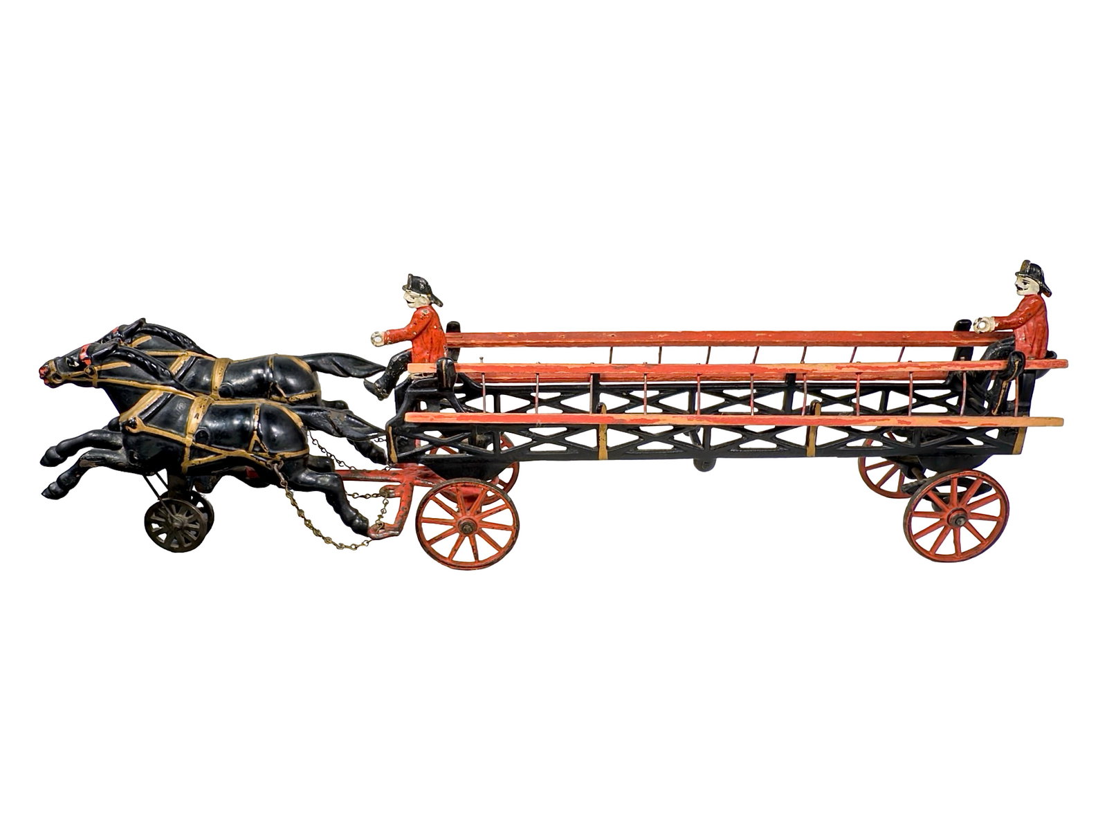 Sleek Two Horse Hook & Ladder - Cast Iron Toy: By Wilkins Hardware Company. Keene, NH - Circa Late 1890's. 20 1/2" Long x 7 1/4" Tall. The John & Kira Olshefski Collection. This is a production match for the previous lot. I love the flat-shaped fi
