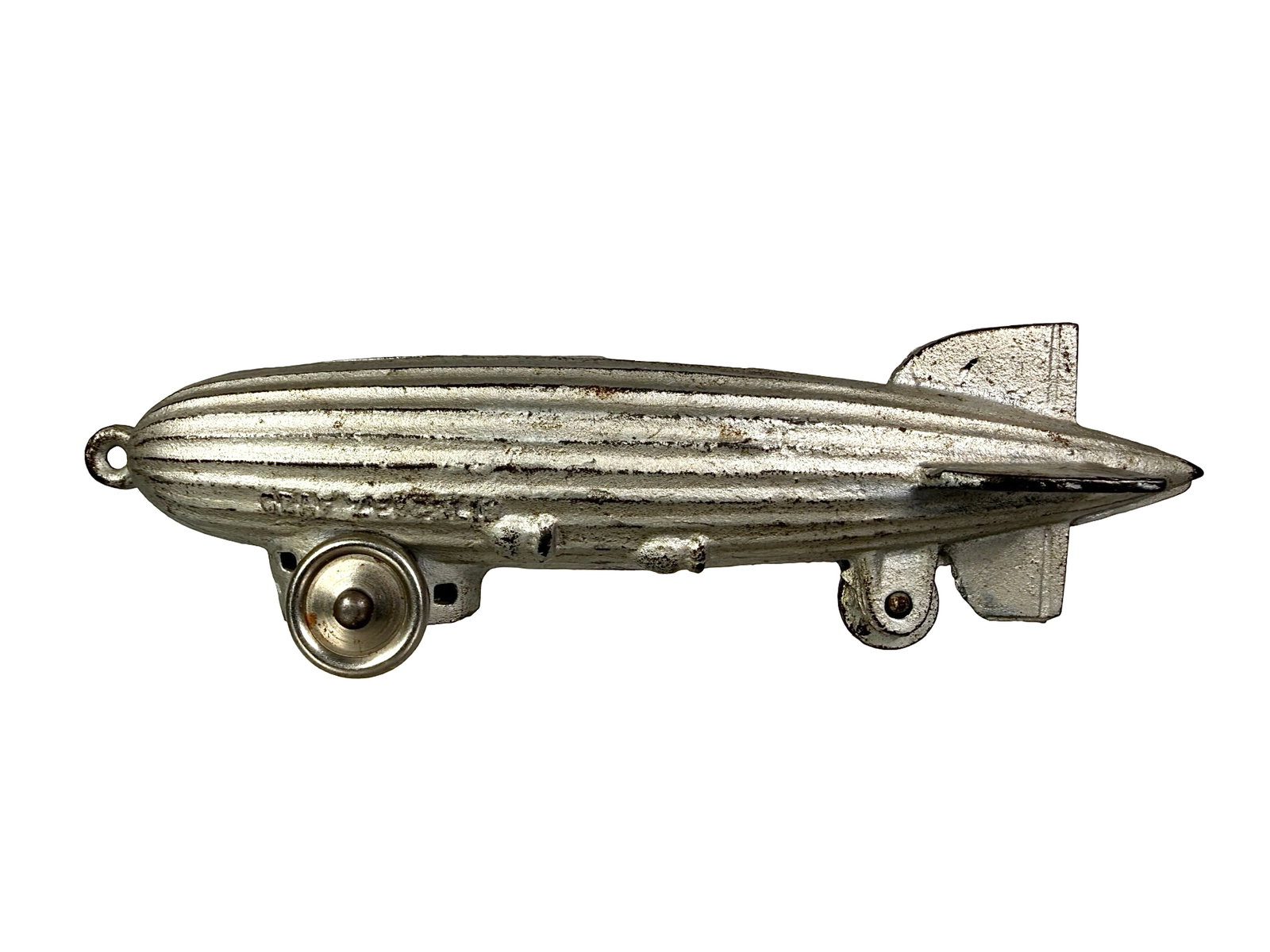 Graf Zeppelin on Wheels - Still Bank: By the A. C. Williams Company. Ohio - 1933 - 2 1/4" T x 7 3/4" W. Bob and Shirley Peirce Collection.