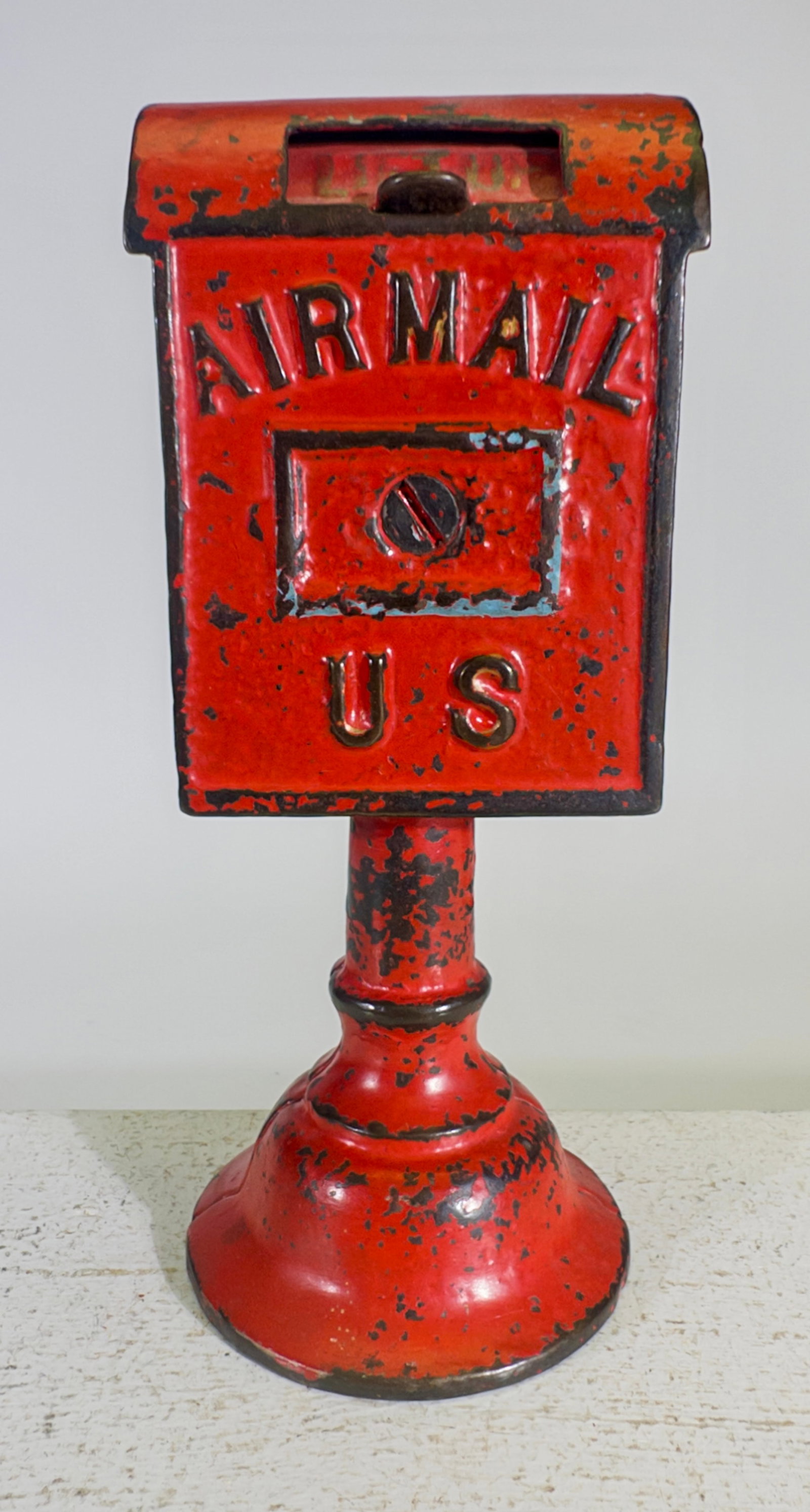 U.S. Air Mail on Base - Cast Iron Still Bank: Dent Hardware Company. Fullerton, PA. 1920's. 6 3/8" Tall x 2 1/2" Wide. Clayton Luther Collection.