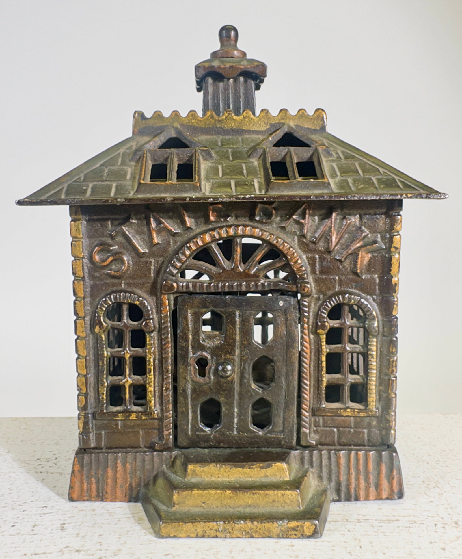 State Bank with Key Lock Door: Kenton Hardware Company. Kenton, OH. 1899, 5 7/8" Tall x 4 5/8" Wide. Clayton Luther Collection.