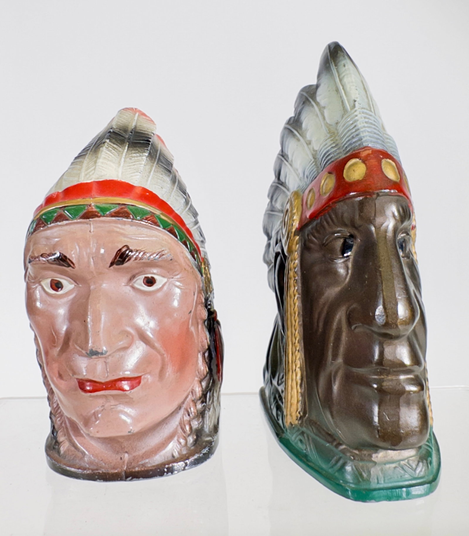 Two Narrow Indian Chief Bust Banks with Key Lock Traps: Japanese 1930's. 4" Tall x 3" Deep. Tom Kellogg Collection.