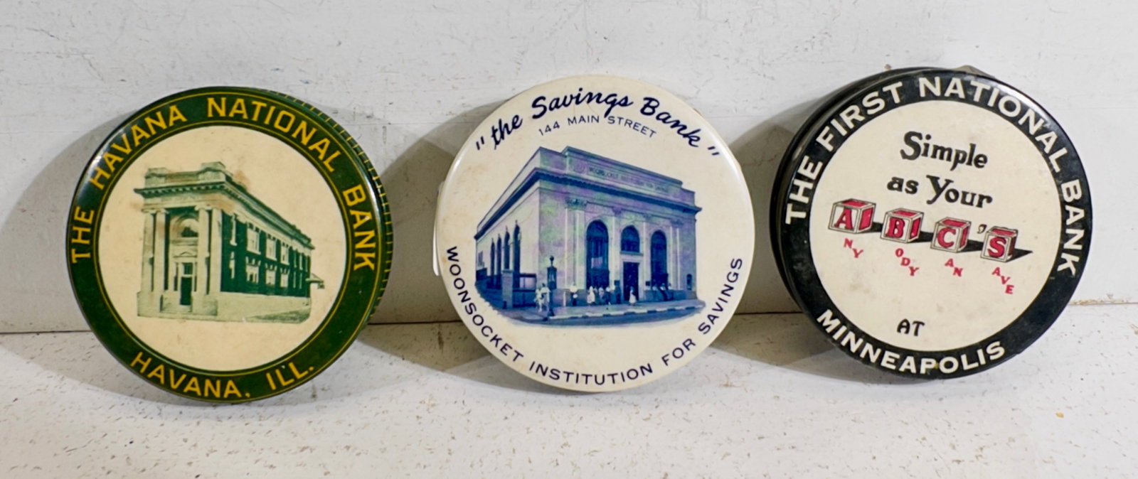 Three Celluloid Dime Banks (1 of 2)