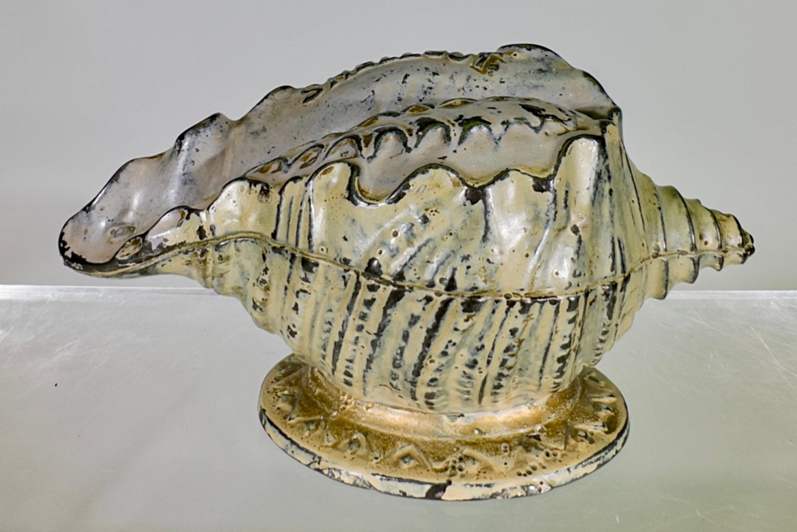 "Shellout" Conch Shell - Cast Iron Still Bank: J & E Stevens Company. Cromwell, CT. 1890's. 3" Tall x 4 3/4" Wide. Tom Kellogg Collection.