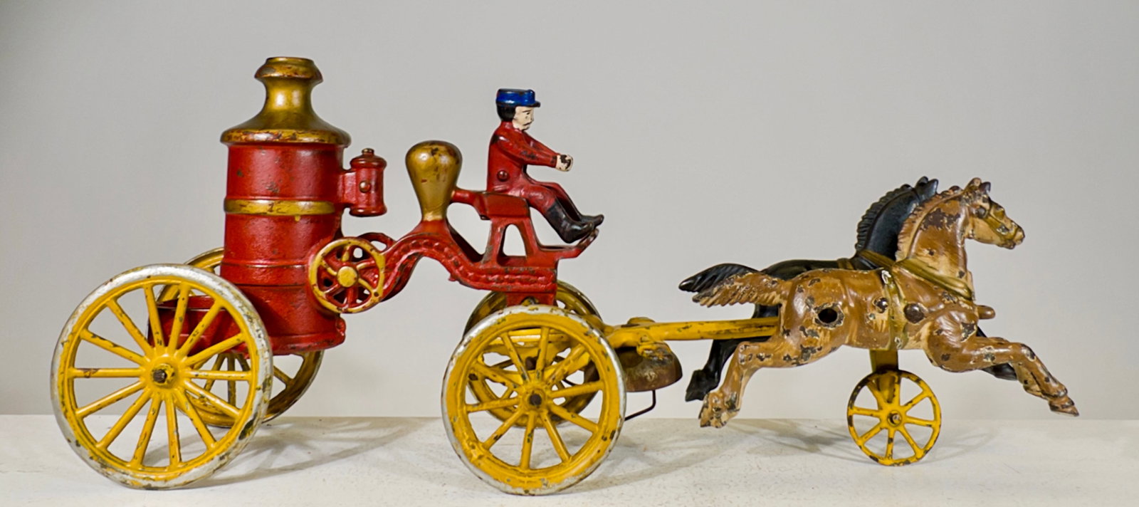 Two Horse Fire Pumper - Cast Iron Toy: Hubley Mfg. Company. Lancaster, PA. - 1915. 7" Tall x 16 1/2" Long. The Olshefski Collection.