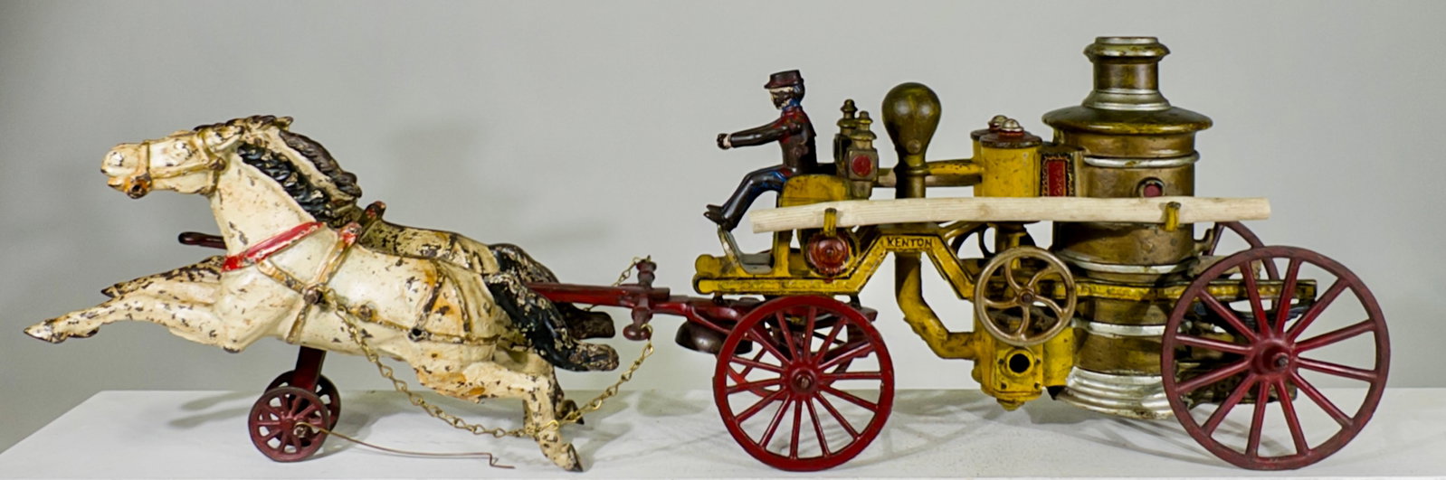 Oversized Fire Pumper - Scarce - Cast Iron Horse Drawn Toy: Kenton Hardware Company. Kenton, OH. - 1915. 8 1/2" Tall x 26" Long. The Olshefski Collection.