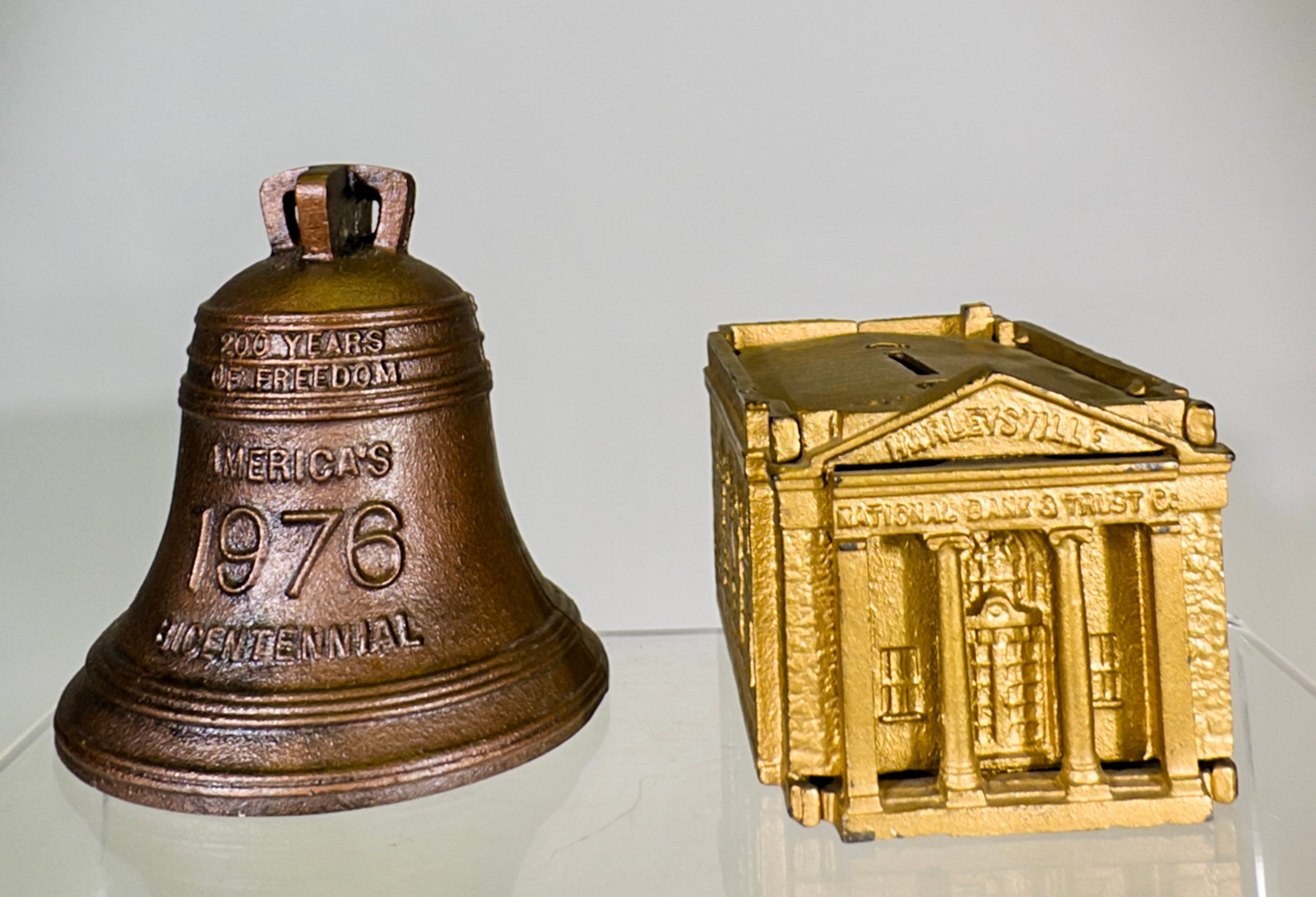 Two Modern Cast Iron Banks: American 1959/1976 - Harleysville is 2 1/2"T x 5 1/8"D