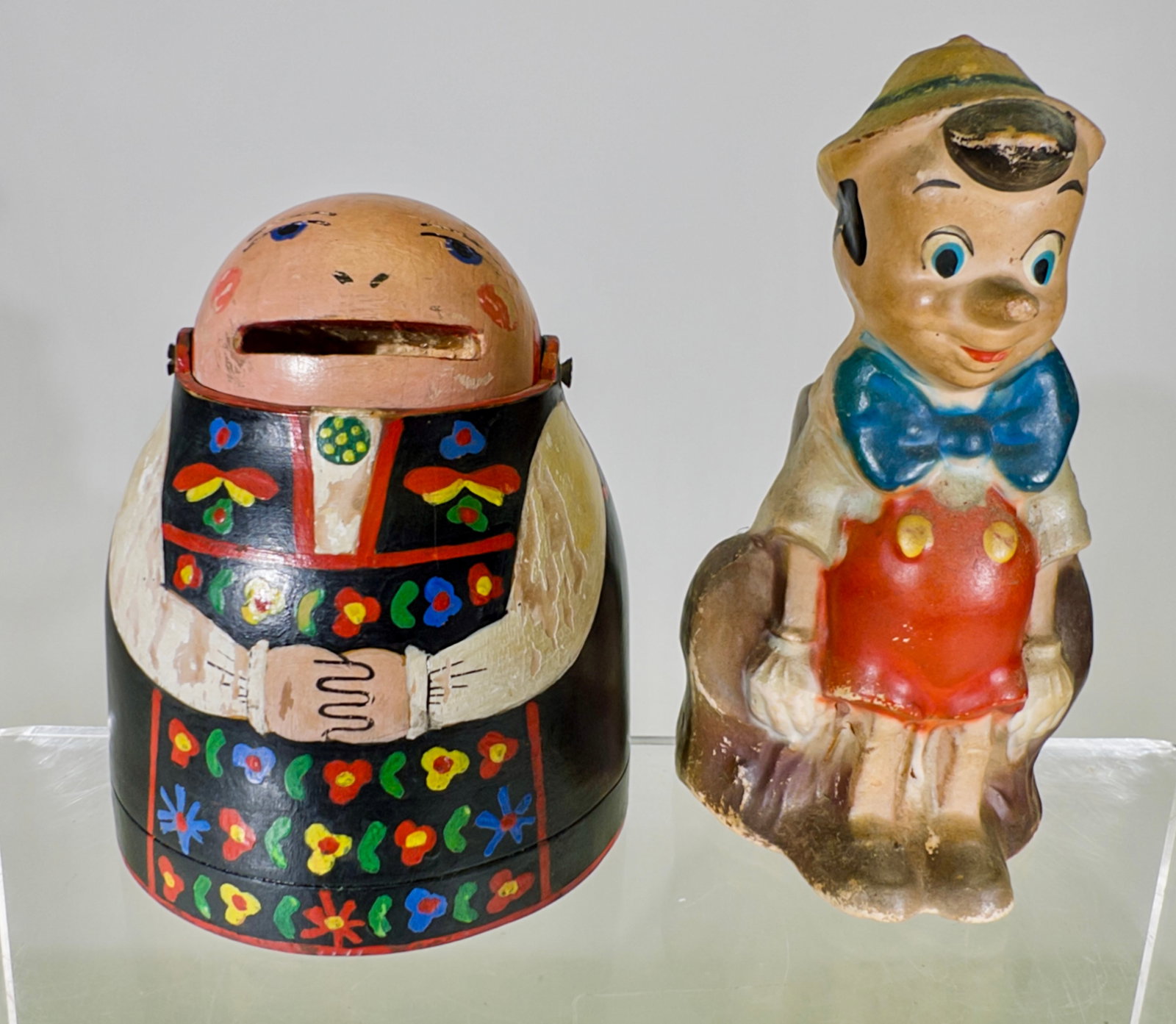 Pinocchio and Bavarian Woman Banks: American/German 1930's - Woman is 4 1/4"T x 3 1/2"Circular