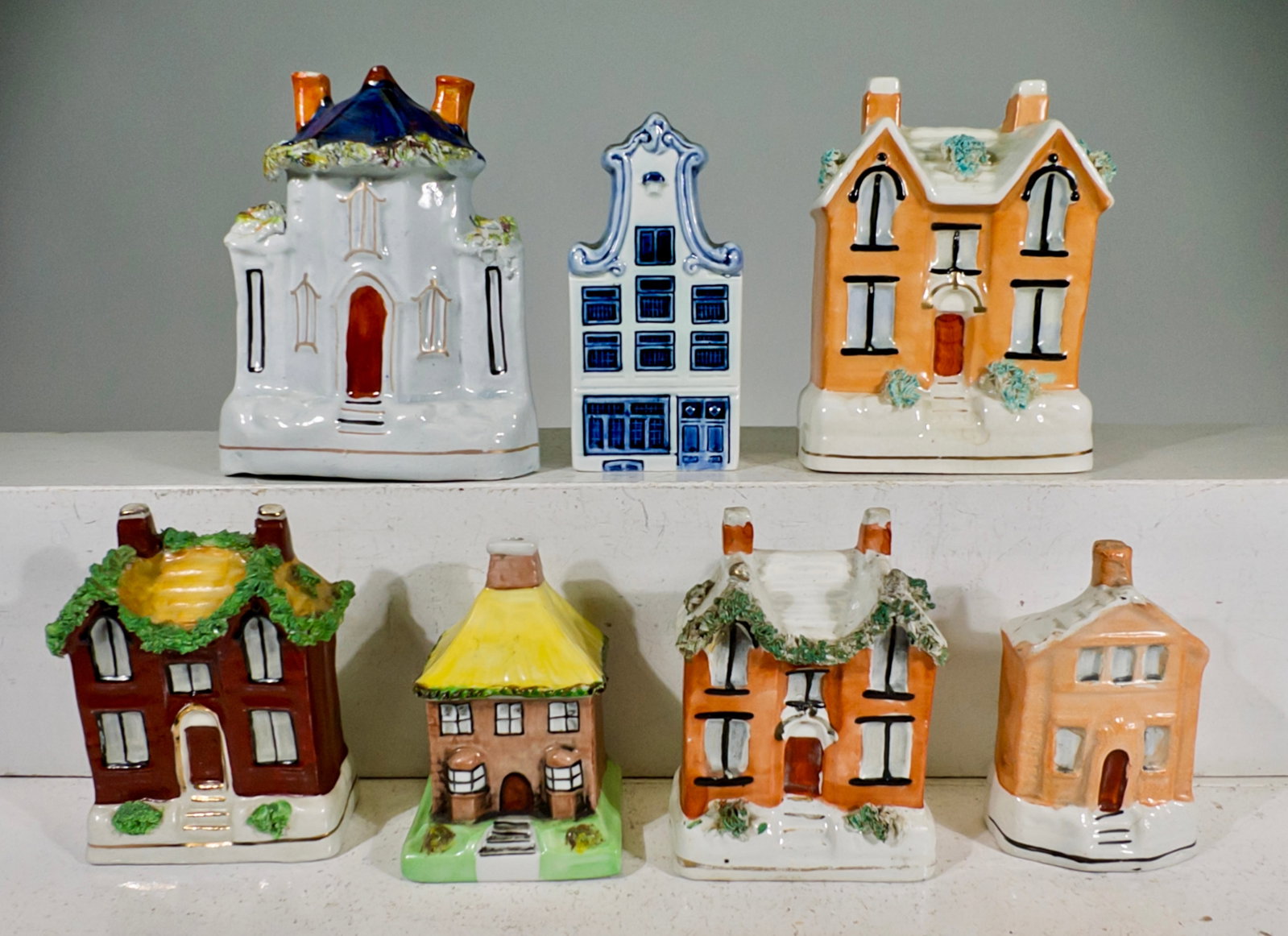 Seven Ceramic Building Banks: European 1910 to 1990 - Tallest is 5"T x 3 3/4"W