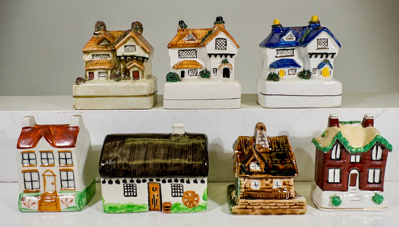 Seven Ceramic Building Banks: European 1910 to 1980 - Largest is 5"T x 4 1/4"W