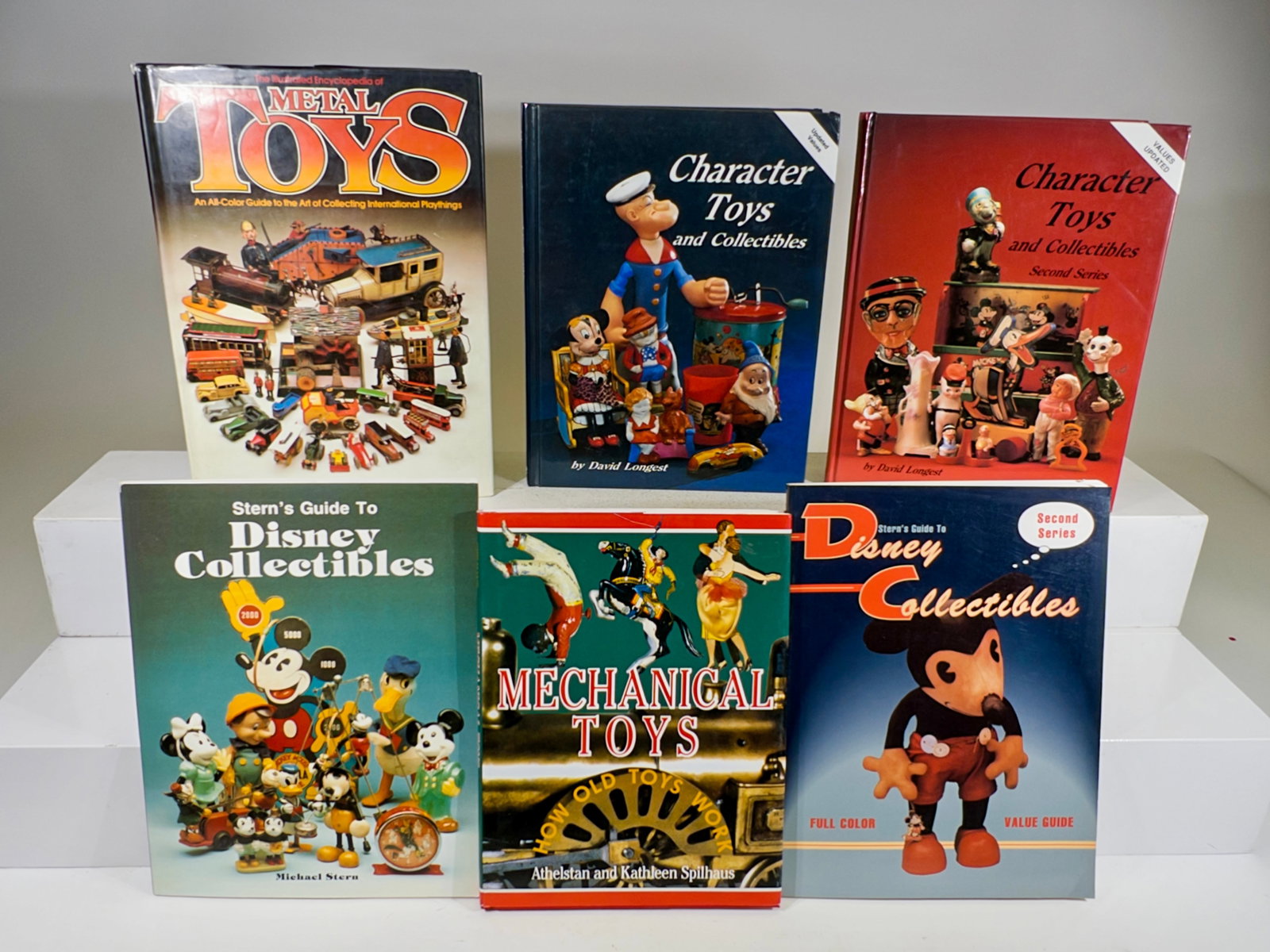 Six Books about Disney or Comic Windup Toys: American - Various sizes