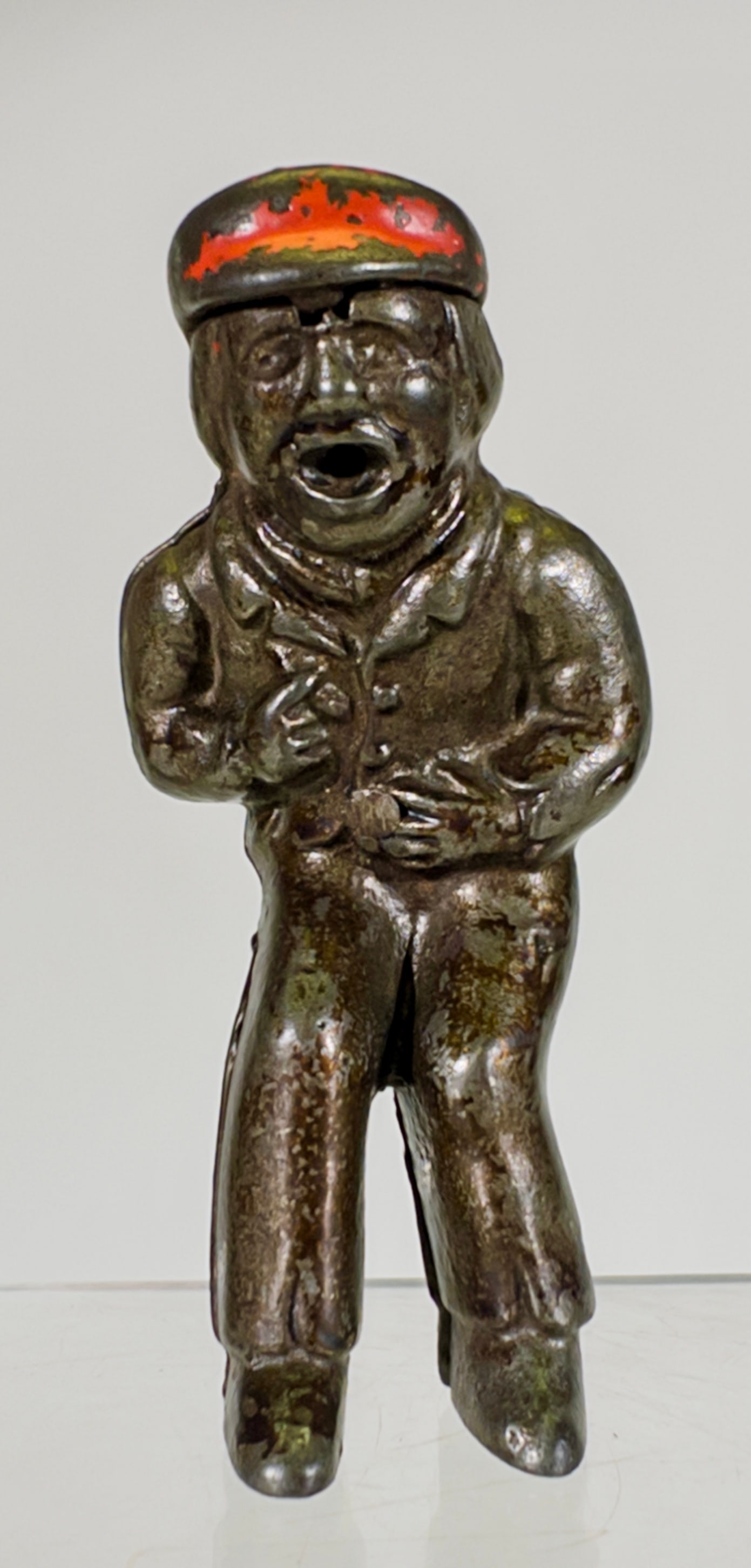 Cast Iron Novelty Toy - Boy Vomiting: Ives, Blakeslee and Company - Bridgeport, CT. 1890 - 3 3/4"L