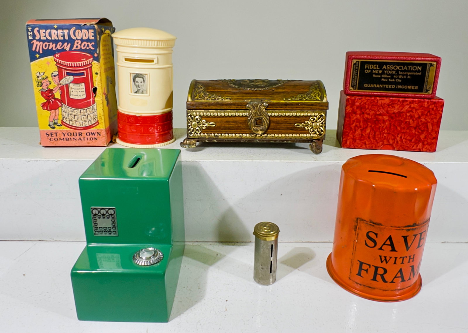 Six Tin or Plastic Still Banks: American / European 1930 to 1950 - Largest is 6 3/4"L x 2 3/4" T