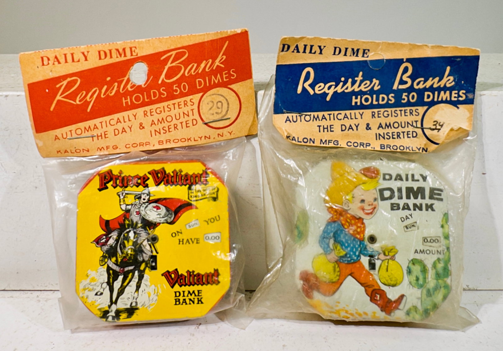 Two Pocket Dime Register Banks - In Original Packaging - Prince Valiant / Daily Dime Cowboy (1 of 2)