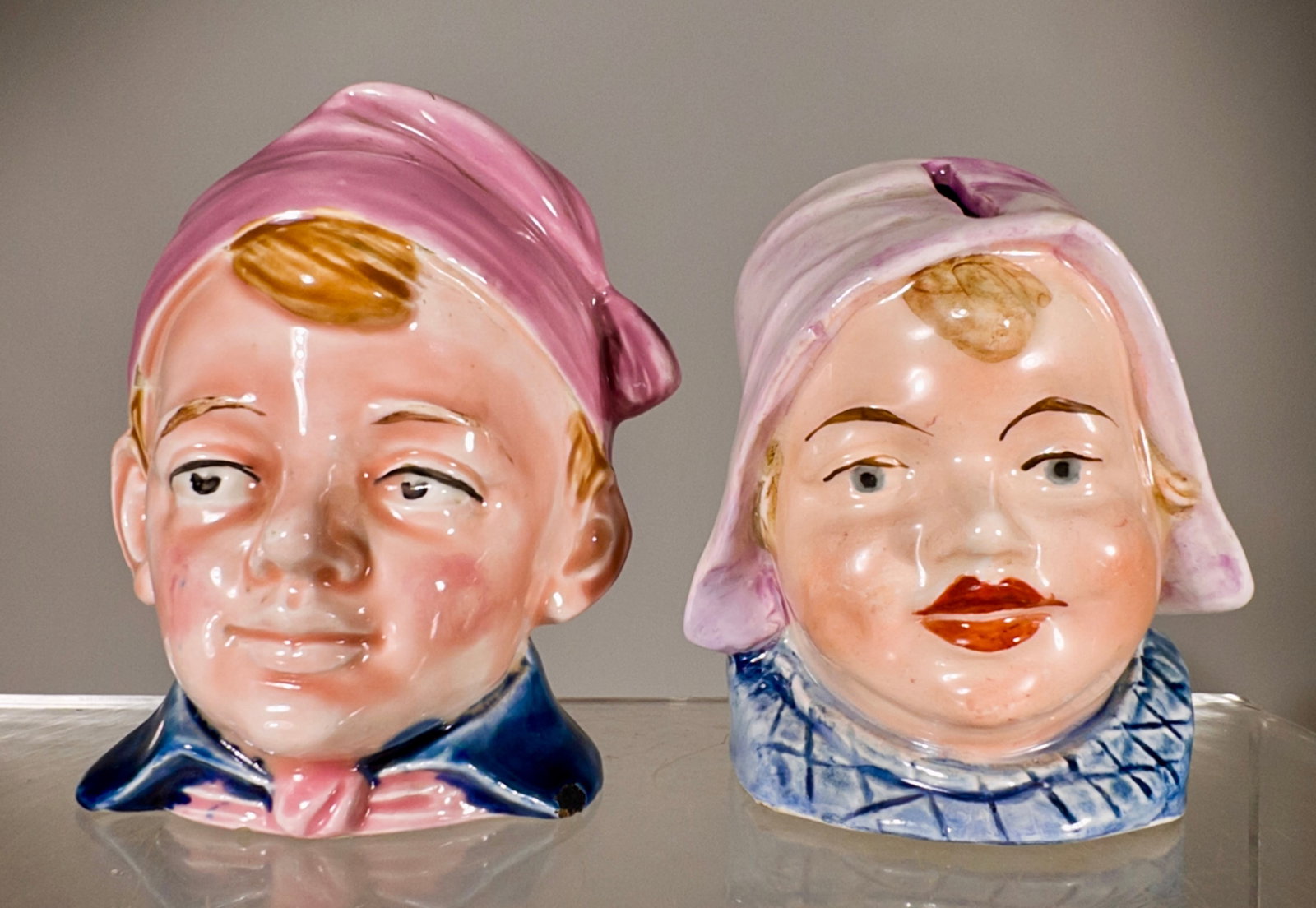 Pair of Ceramic Bust Banks with Purple Hats (1 of 2)