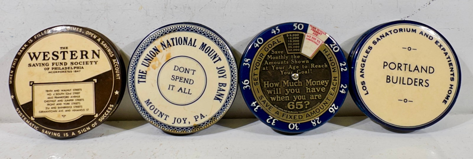 Four Celluloid Dime Register Banks (1 of 2)