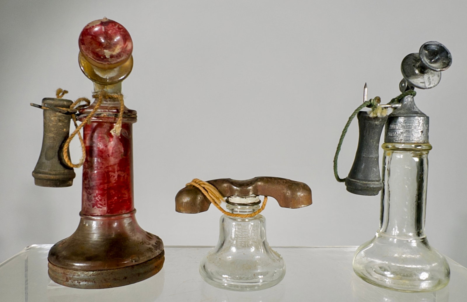 Three Telephone Glass Candy Containers: American 1920/30's - Tallest is 4 1/4"T