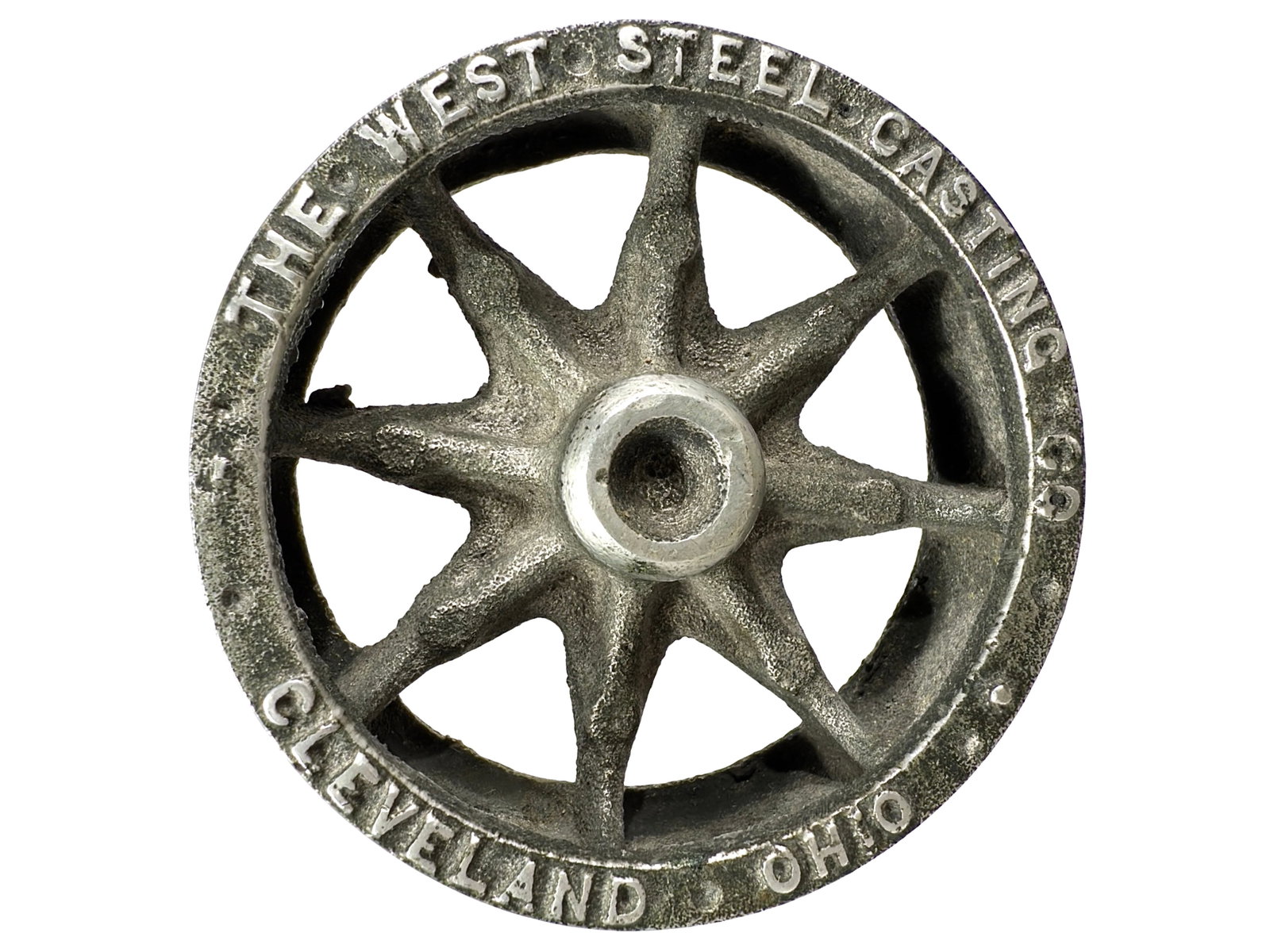The West Steel Casting Co. - Advertising Paperweight - Alloy Material: Cleveland, Oh. - Circa 1930's. 1" Tall x 2 3/4" Circular. The Peirce Collection.
