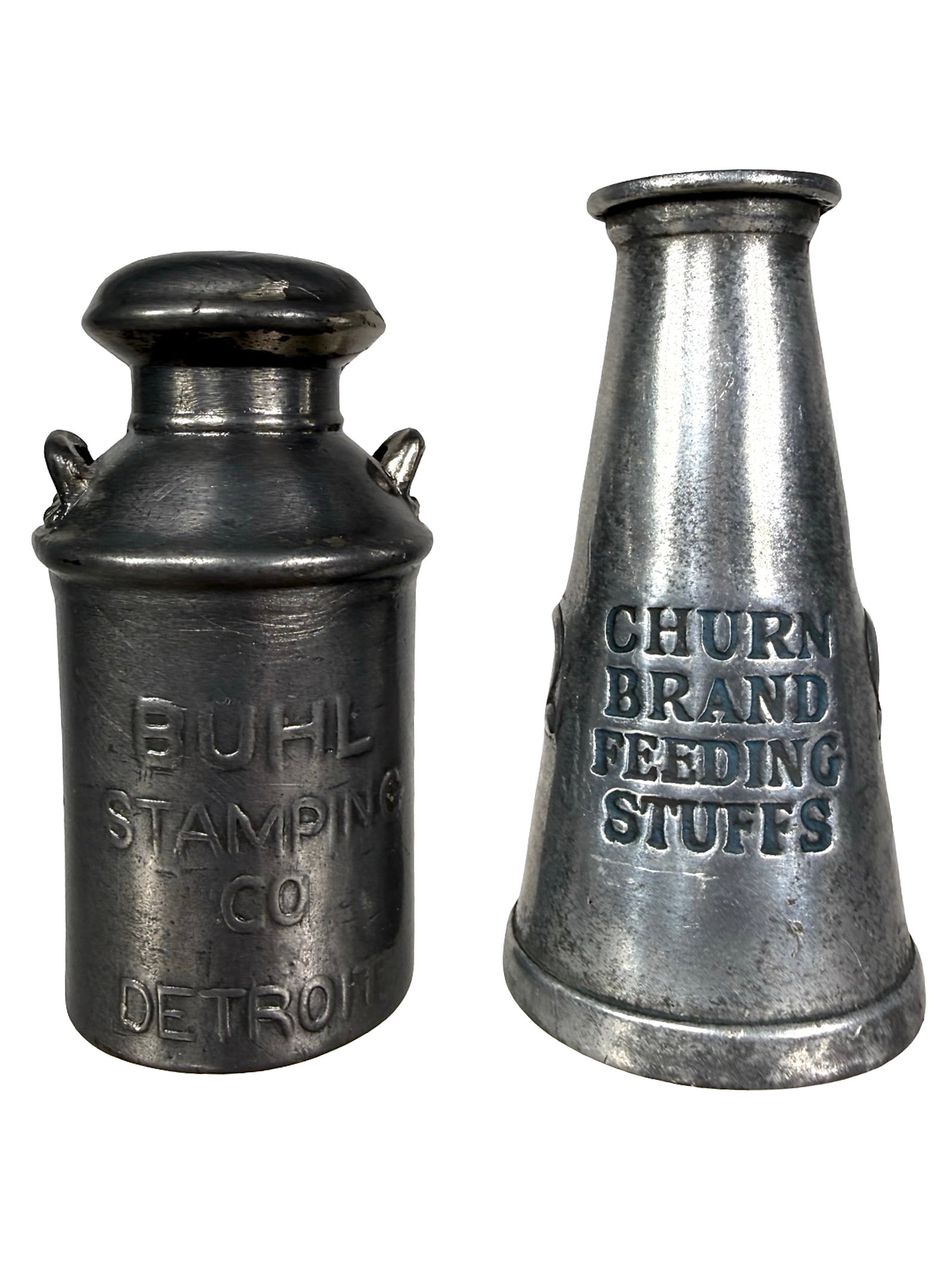 Two Lead Advertising Paperweights (1 of 7)